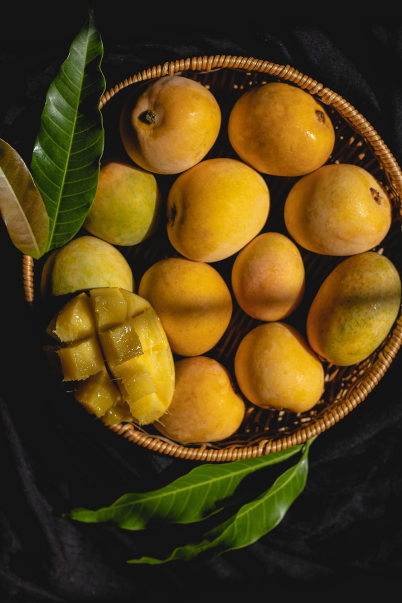 Premium Alphonso mangoes in basket — king of fruits